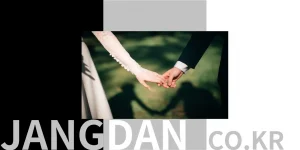 couple-holding-hands-at-wedding-photo